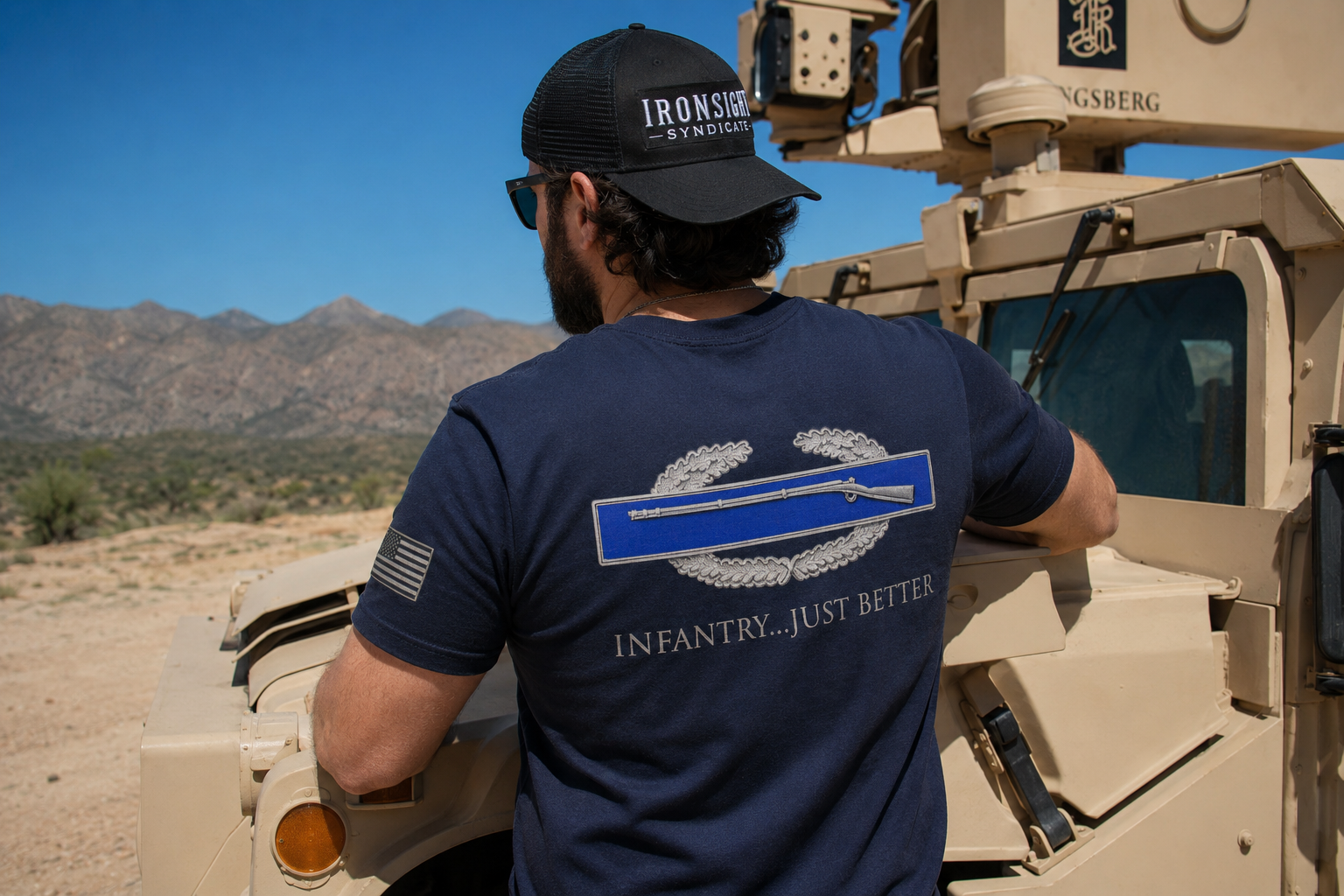 Man wearing an Ironsight Syndicate shirt with a Combat Infantryman's Badge printed on the back.  